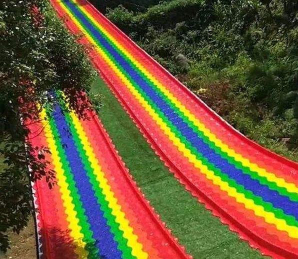 What key factors should be compared when purchasing a rainbow slide?
